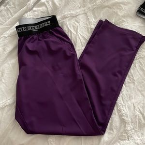 Purple Skechers scrub pants